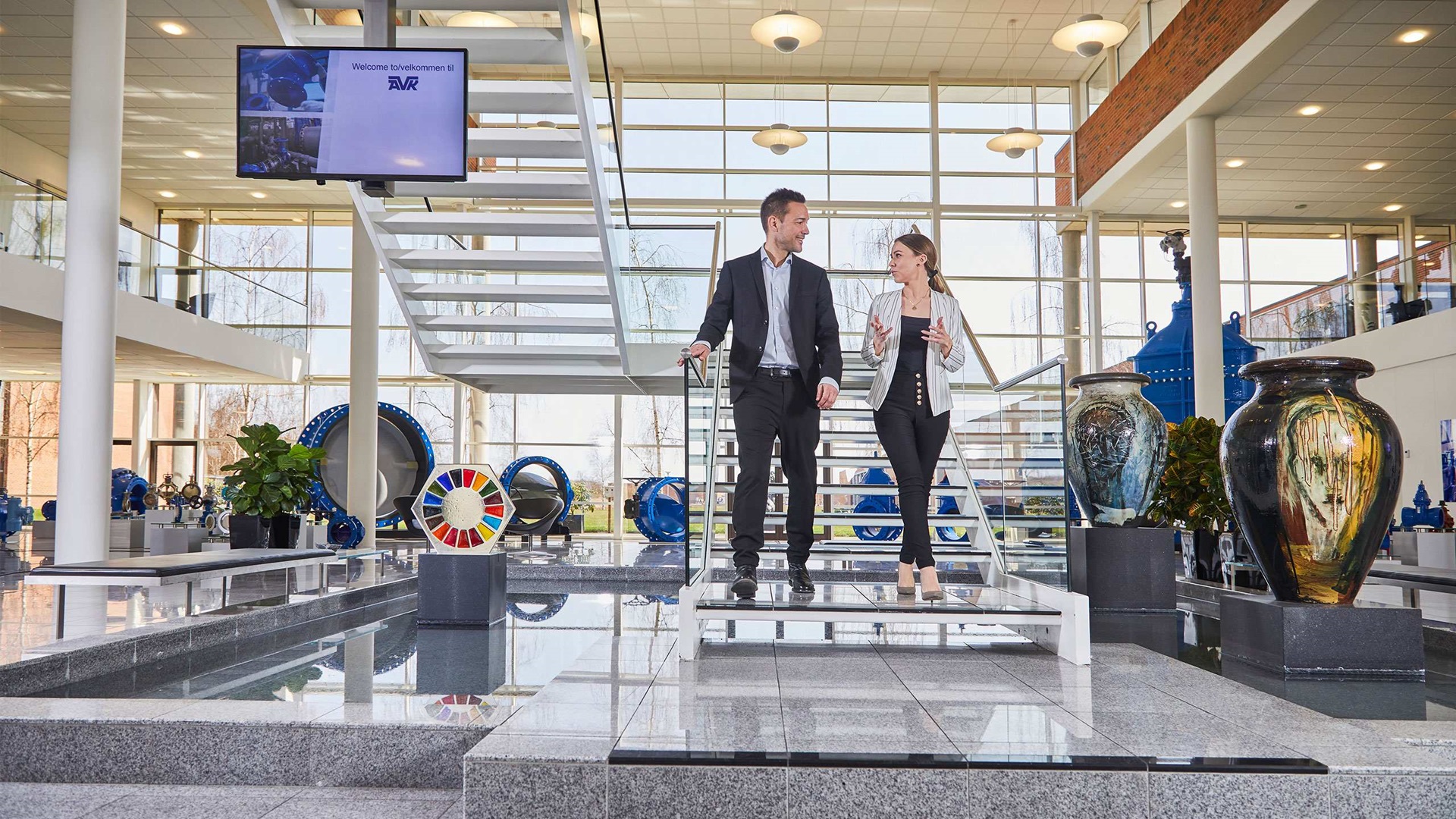 Entrance hall at AVK International AS - people coming down the stairs