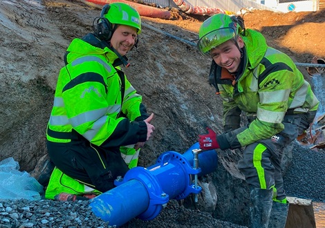 Smiling workers with the supa one coupling