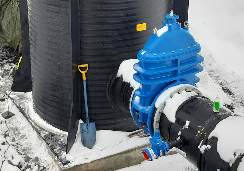 AVK valve installed on black barrel outside in Finland, Agnico Eagle project