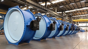 Large butterfly valves ready for installation in a warehouse